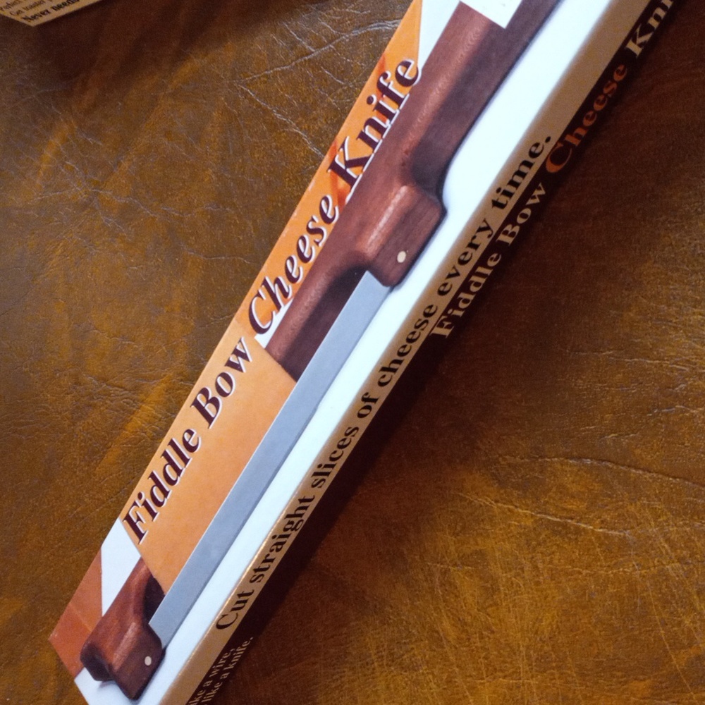 NIB! The Original Fiddle Bow Cheese Knife
